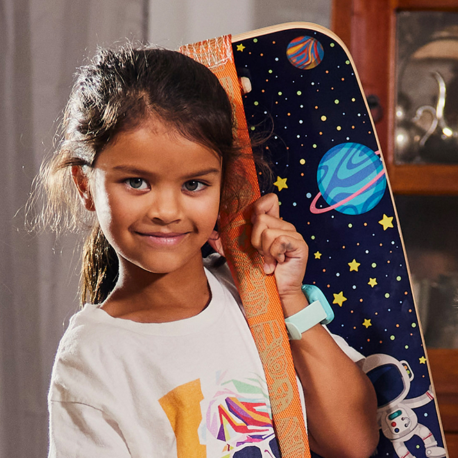 Child holding an Astro slackboard 